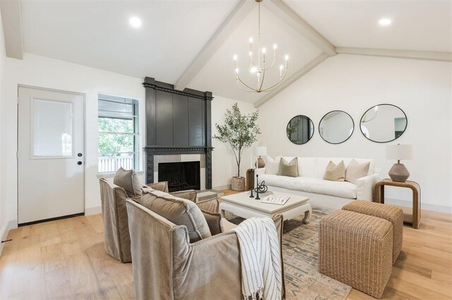 1112 Mary Lee Ln, Edmond, OK 73034 - living room with light wood finished floors, a chandelier, a fireplace, and recessed lighting