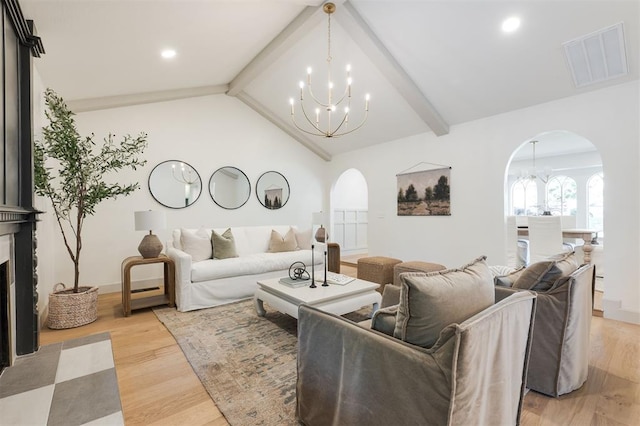 1112 Mary Lee Ln, Edmond, OK 73034 - living area with arched walkways, a chandelier, light wood-type flooring, and recessed lighting