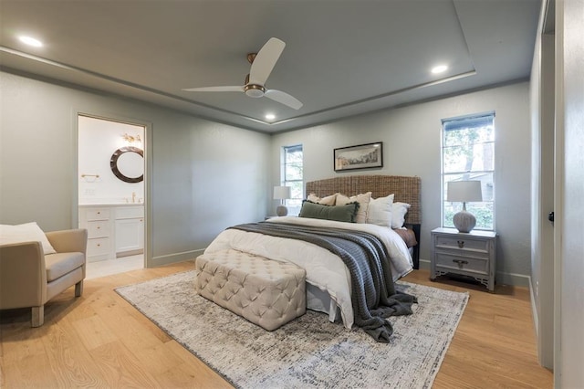 1112 Mary Lee Ln, Edmond, OK 73034 - bedroom with light wood-style flooring, ensuite bathroom, recessed lighting, and ceiling fan