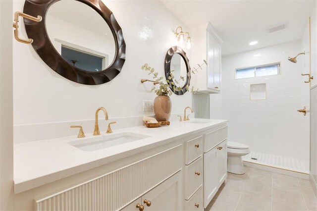 1112 Mary Lee Ln, Edmond, OK 73034 - bathroom featuring tile patterned floors, double vanity, and tiled shower