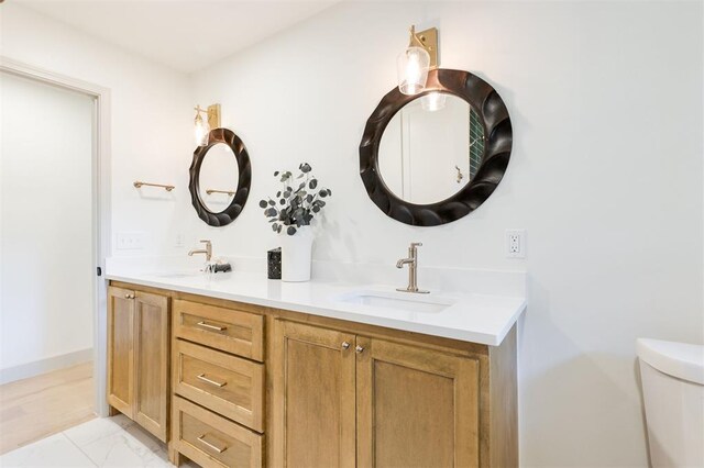 1112 Mary Lee Ln, Edmond, OK 73034 - bathroom featuring double vanity and marble look tiles