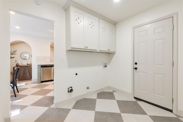 1112 Mary Lee Ln, Edmond, OK 73034 - laundry room featuring cabinet space, hookup for a gas dryer, light flooring, arched walkways, and hookup for a washing machine