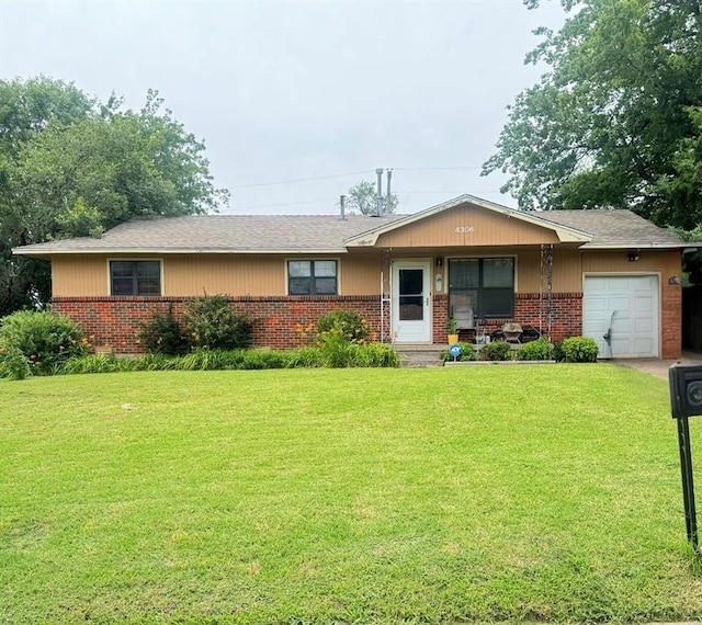 4306 NW Williams Ave, Lawton, OK 73505 - single story home featuring a garage, brick siding, and a front lawn