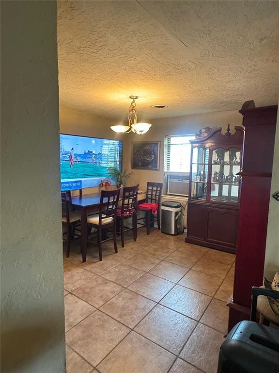 4306 NW Williams Ave, Lawton, OK 73505 - dining room featuring a chandelier, light tile patterned flooring, and a textured ceiling
