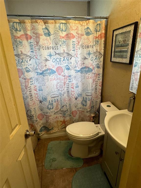 4306 NW Williams Ave, Lawton, OK 73505 - full bath with vanity and a shower with shower curtain