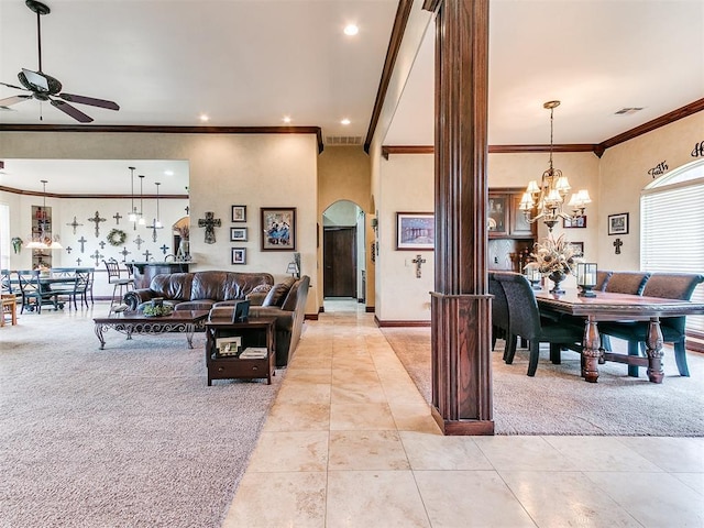 3705 Dalston Cir, Norman, OK 73072 - living room with light carpet, crown molding, ceiling fan, light tile patterned flooring, and arched walkways