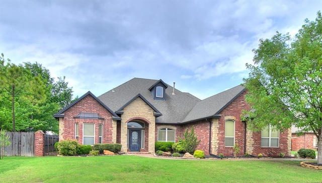 3705 Dalston Cir, Norman, OK 73072 - view of front of home featuring brick siding, stone siding, and a shingled roof