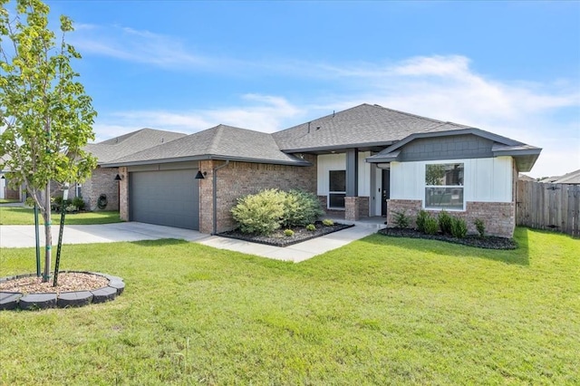 1108 Blackjack Creek Dr, Yukon, OK 73099 - view of front of home with a shingled roof, brick siding, an attached garage, and driveway