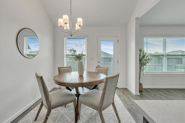 1108 Blackjack Creek Dr, Yukon, OK 73099 - dining space featuring a chandelier and light wood-style flooring