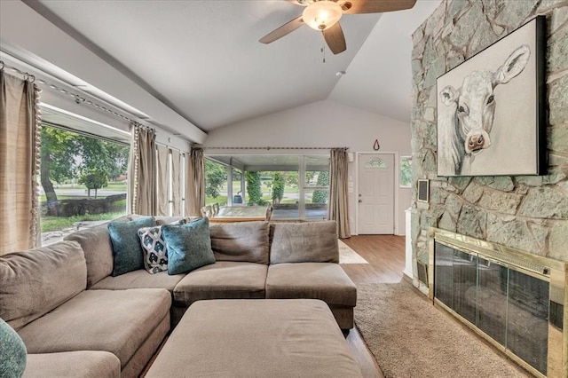 417 Garth Brooks Blvd, Yukon, OK 73099 - living room with plenty of natural light, a ceiling fan, lofted ceiling, wood finished floors, and a fireplace