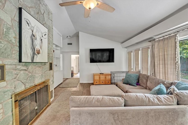417 Garth Brooks Blvd, Yukon, OK 73099 - living room featuring wood finished floors, vaulted ceiling, a fireplace, and a ceiling fan