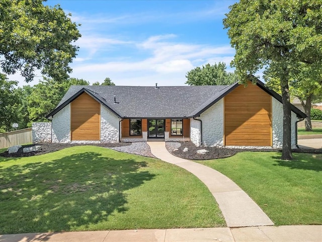 1205 Shalamar Rd, Edmond, OK 73013 - view of front of house featuring stone siding, french doors, and a shingled roof