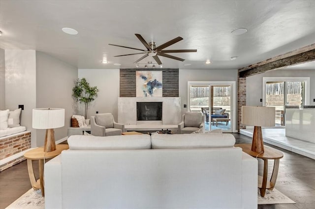 1205 Shalamar Rd, Edmond, OK 73013 - living area with dark wood finished floors, a ceiling fan, recessed lighting, and a premium fireplace