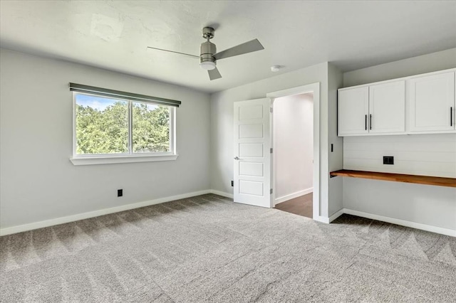 1205 Shalamar Rd, Edmond, OK 73013 - unfurnished bedroom with dark carpet and a ceiling fan