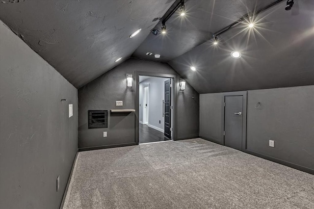 1205 Shalamar Rd, Edmond, OK 73013 - bonus room with dark colored carpet and vaulted ceiling