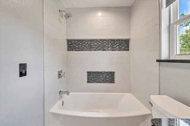 1205 Shalamar Rd, Edmond, OK 73013 - bathroom featuring  shower combination and a textured wall