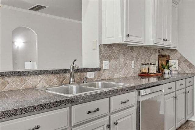 732 Tuscany Way, Edmond, OK 73034 - kitchen featuring dishwasher, ornamental molding, white cabinetry, and tasteful backsplash