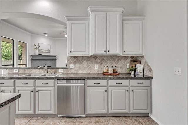 732 Tuscany Way, Edmond, OK 73034 - kitchen with stainless steel dishwasher, backsplash, white cabinets, and crown molding