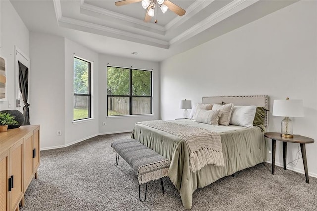 732 Tuscany Way, Edmond, OK 73034 - carpeted bedroom with crown molding and a tray ceiling