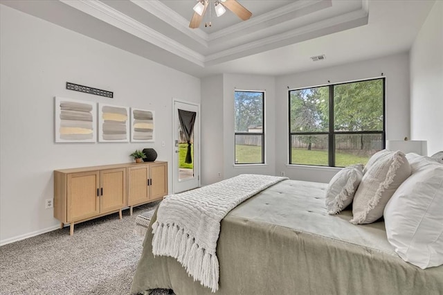 732 Tuscany Way, Edmond, OK 73034 - bedroom featuring a raised ceiling, ornamental molding, light carpet, access to outside, and ceiling fan