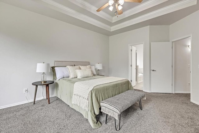 732 Tuscany Way, Edmond, OK 73034 - bedroom with ornamental molding, carpet, a tray ceiling, a ceiling fan, and connected bathroom