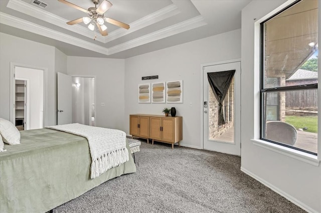 732 Tuscany Way, Edmond, OK 73034 - bedroom with carpet floors, ornamental molding, access to exterior, a tray ceiling, and ceiling fan
