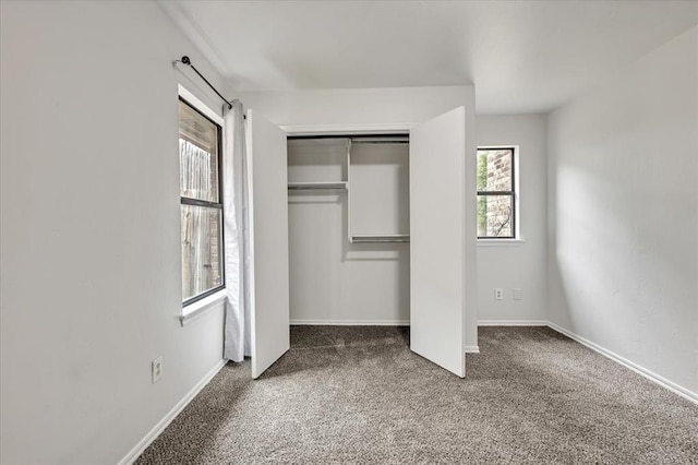732 Tuscany Way, Edmond, OK 73034 - unfurnished bedroom with carpet and a closet