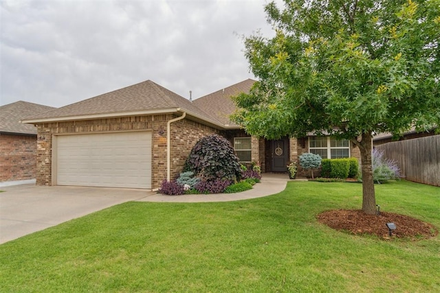 609 NW 180th St, Edmond, OK 73012 - view of front of home with brick siding, roof with shingles, an attached garage, and concrete driveway