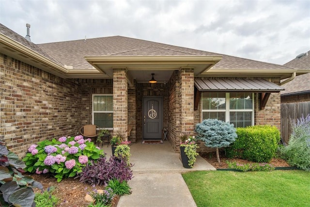 609 NW 180th St, Edmond, OK 73012 - entrance to property with brick siding, a shingled roof, and a porch