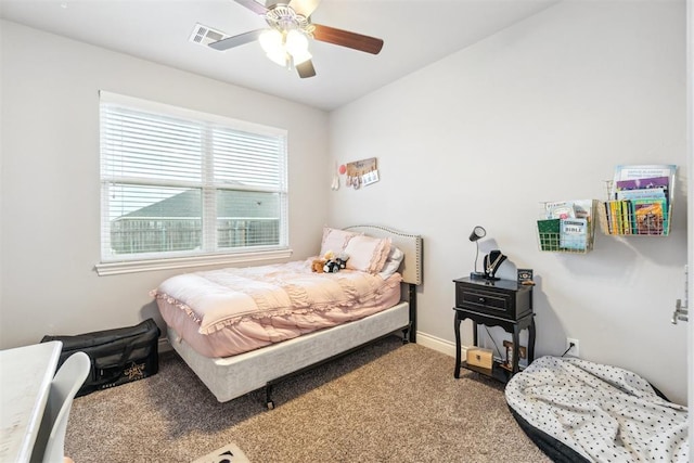 609 NW 180th St, Edmond, OK 73012 - carpeted bedroom with ceiling fan and baseboards