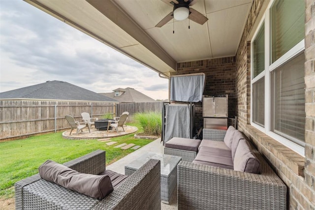 609 NW 180th St, Edmond, OK 73012 - fenced backyard with an outdoor living space with a fire pit, ceiling fan, and a patio