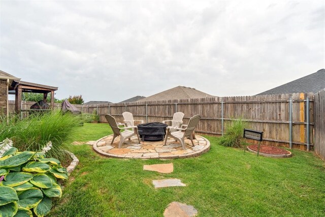 609 NW 180th St, Edmond, OK 73012 - fenced backyard with an outdoor fire pit and a patio area