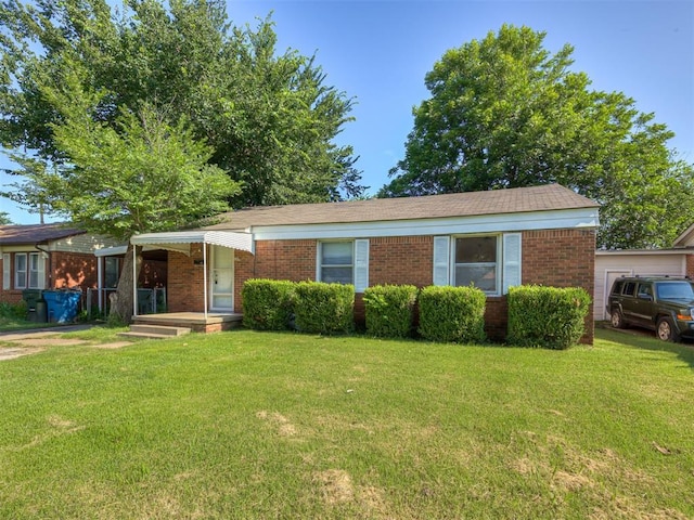 109 E Northrup Dr, Oklahoma City, OK 73110 - ranch-style home with brick siding and a front lawn