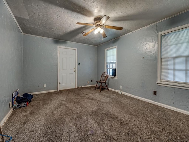 109 E Northrup Dr, Oklahoma City, OK 73110 - unfurnished room featuring a ceiling fan, carpet, a textured wall, ornamental molding, and a textured ceiling