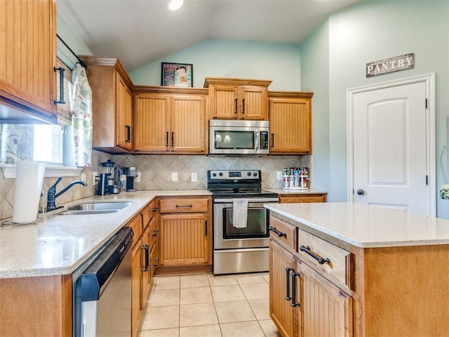 13312 4th Ter, Yukon, OK 73099 - kitchen featuring appliances with stainless steel finishes, light tile patterned flooring, decorative backsplash, light stone counters, and lofted ceiling