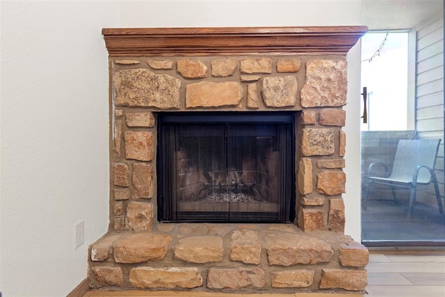 14405 N Pennsylvania Ave Unit 6D, Oklahoma City, OK 73134 - detailed view of a stone fireplace and wood finished floors