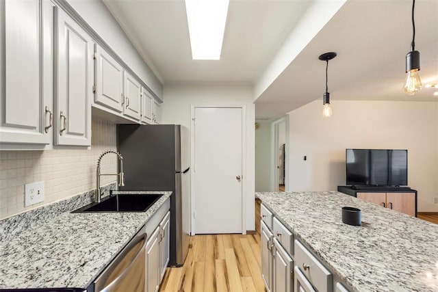 14405 N Pennsylvania Ave Unit 6D, Oklahoma City, OK 73134 - kitchen with stainless steel appliances, light wood finished floors, tasteful backsplash, light stone counters, and ornamental molding