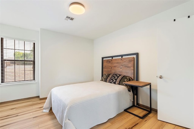 14405 N Pennsylvania Ave Unit 6D, Oklahoma City, OK 73134 - bedroom featuring light wood finished floors