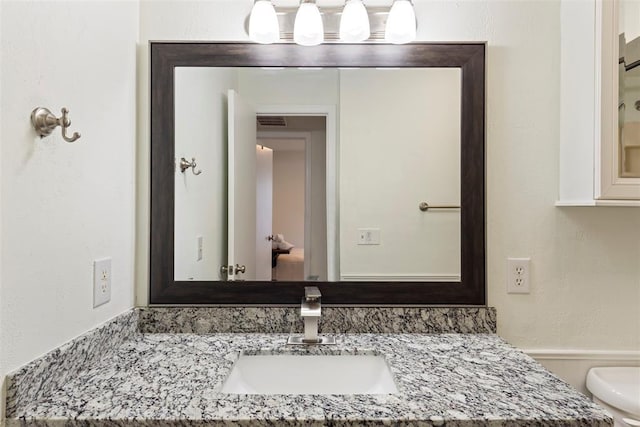 14405 N Pennsylvania Ave Unit 6D, Oklahoma City, OK 73134 - bathroom featuring vanity and toilet