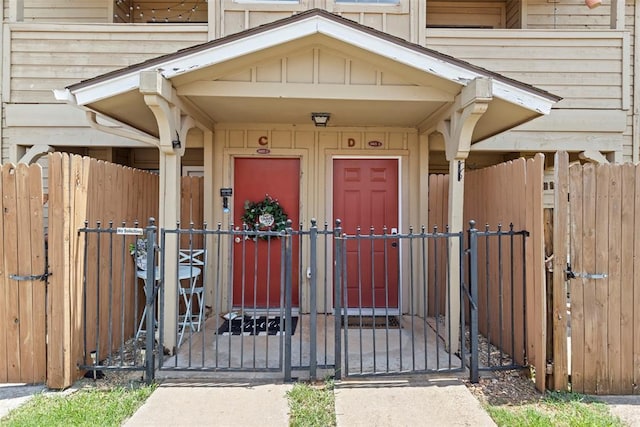 14405 N Pennsylvania Ave Unit 6D, Oklahoma City, OK 73134 - doorway to property with a gate and board and batten siding