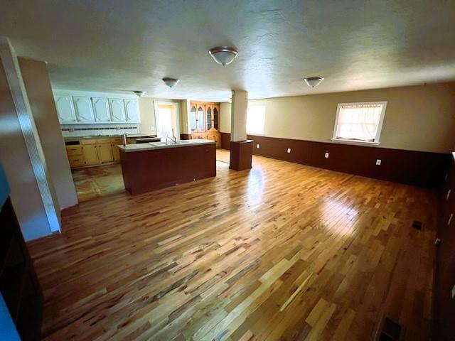 502 E Cavalry St, Cordell, OK 73632 - unfurnished living room with wood finished floors