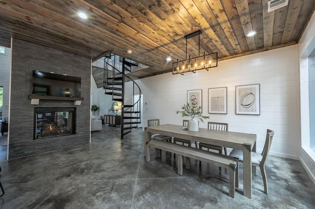 316 Triton Trl, Broken Bow, OK 74728 - dining area with stairs, concrete floors, wooden ceiling, a chandelier, and a multi sided fireplace