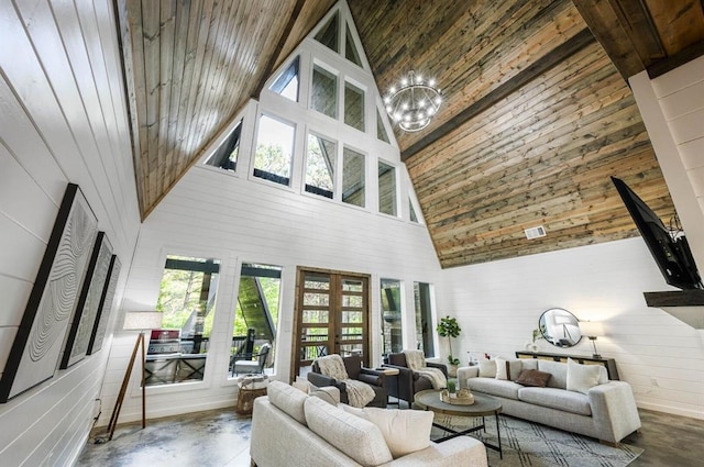 316 Triton Trl, Broken Bow, OK 74728 - living room with high vaulted ceiling, concrete floors, french doors, a chandelier, and wood walls