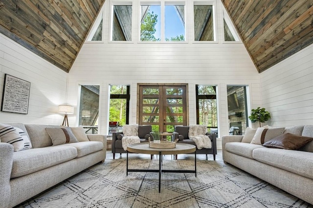 316 Triton Trl, Broken Bow, OK 74728 - living area with high vaulted ceiling, wooden ceiling, wood walls, and french doors