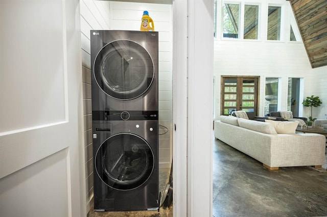 316 Triton Trl, Broken Bow, OK 74728 - laundry area with stacked washer and clothes dryer, plenty of natural light, and french doors