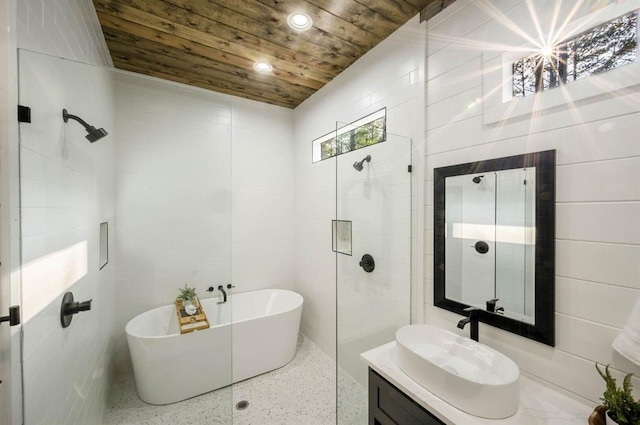 316 Triton Trl, Broken Bow, OK 74728 - bathroom featuring wooden ceiling, speckle patterned floor, a freestanding tub, vanity, and recessed lighting