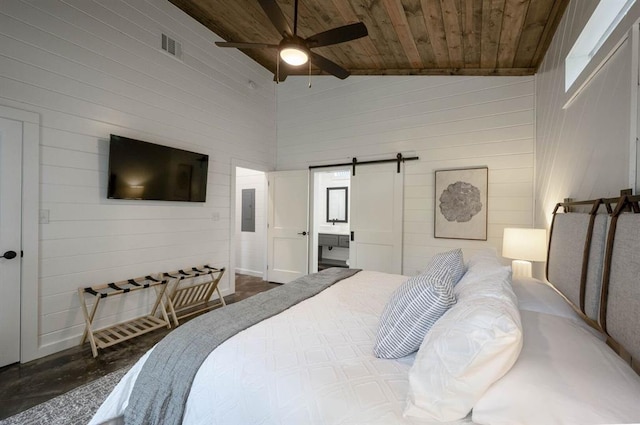 316 Triton Trl, Broken Bow, OK 74728 - bedroom with vaulted ceiling, wooden ceiling, a barn door, electric panel, and wooden walls