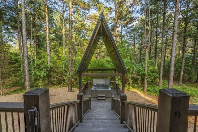 316 Triton Trl, Broken Bow, OK 74728 - wooden terrace with a hot tub and a view of trees