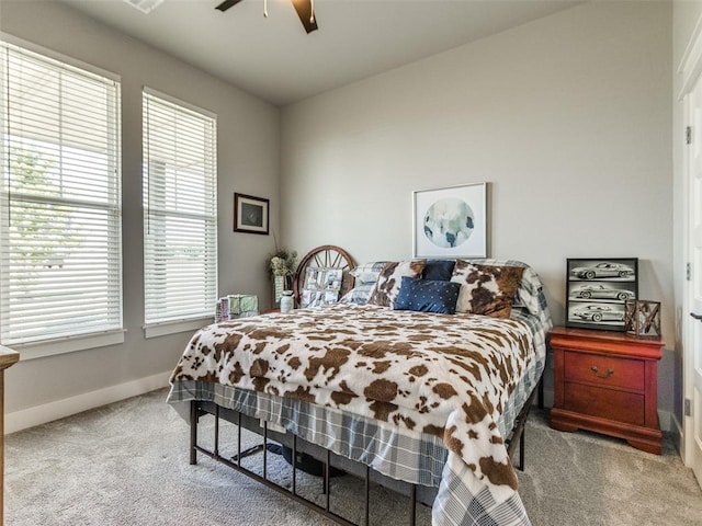22795 Cterling Dr, Kingfisher, OK 73750 - bedroom featuring carpet flooring, multiple windows, and a ceiling fan