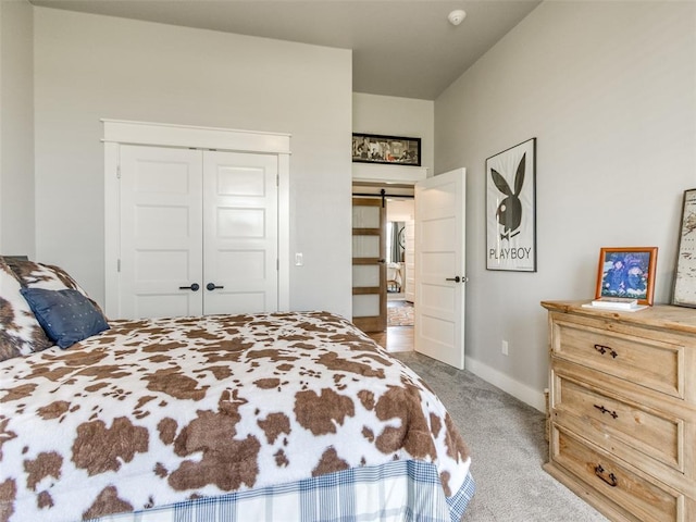 22795 Cterling Dr, Kingfisher, OK 73750 - bedroom featuring carpet flooring, a barn door, and a closet
